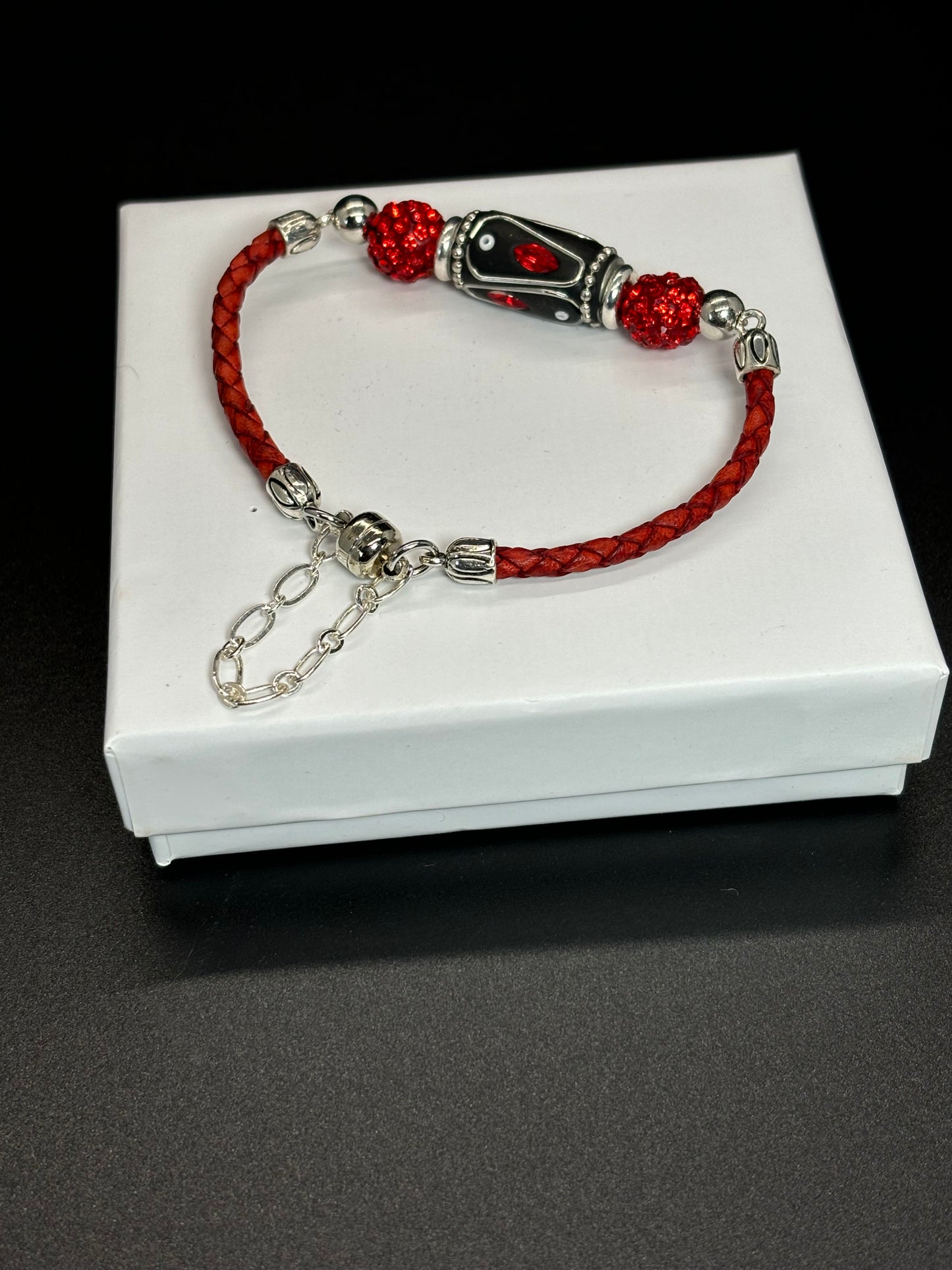 BR-0068 Red Bracelet with Black and Red Clay Beads, Red Leather Straps and a Magnet Closure