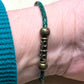 BR-0112 Mystic Aura Quartz Beads with Forest Green Leather Band
