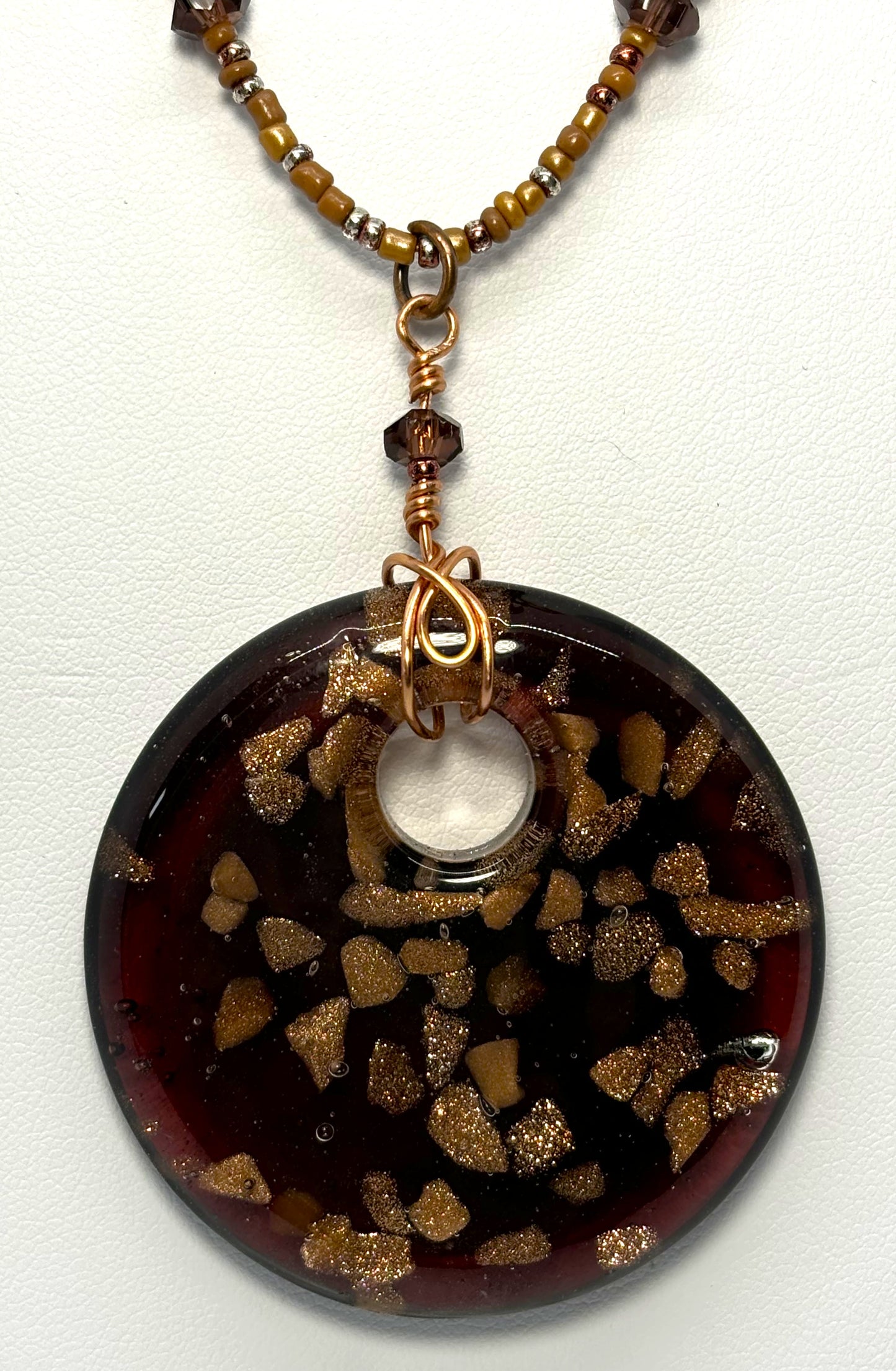 NE-0072 Unique Plum-colored Glass Pendant with Copper Flecks Mounted on a Beaded Necklace