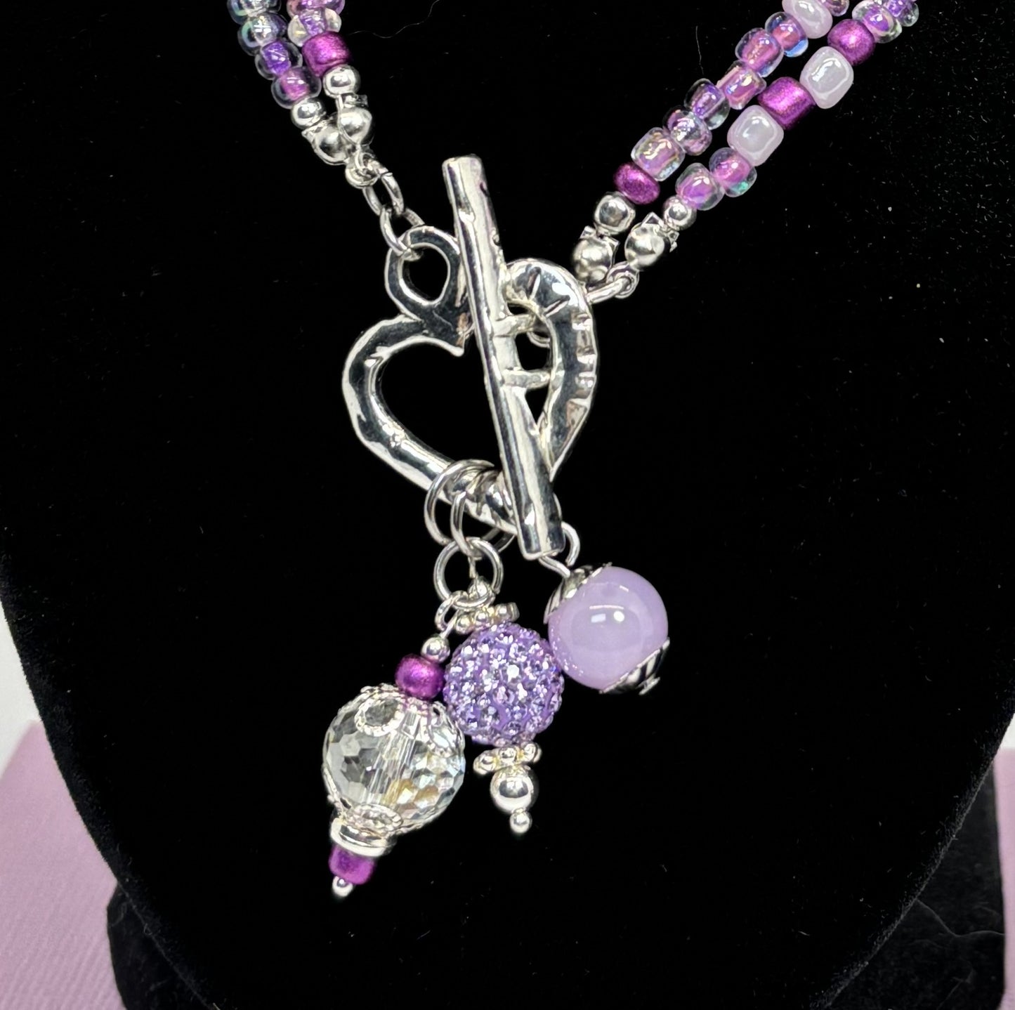 NE-0062 Lovely Silver Heart Toggle Necklace with Captivating Medley of Purple Beads