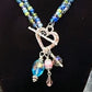 Necklace Heart Toggle Clasp with colorful beads and charms added on a black background